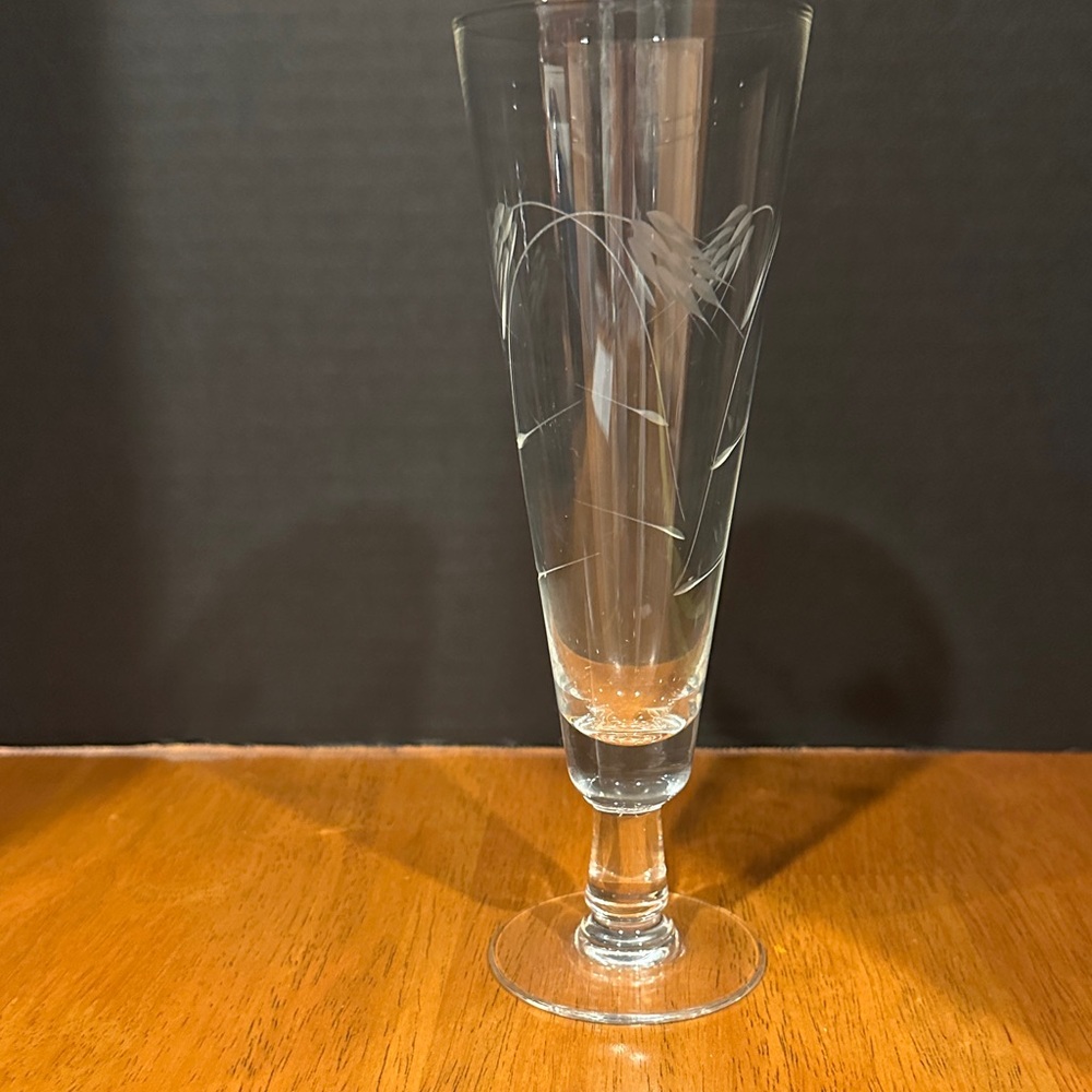 Sasaki Clear Glass Pilsner or Champagne Flute, in the Etched Wheat Pattern.